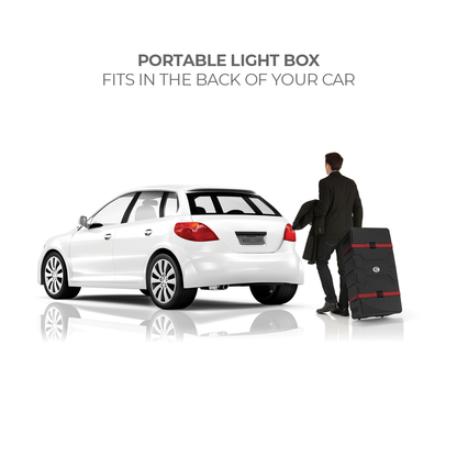 Man carrying portable light box with wheels next to a car, ideal for trade shows and events
