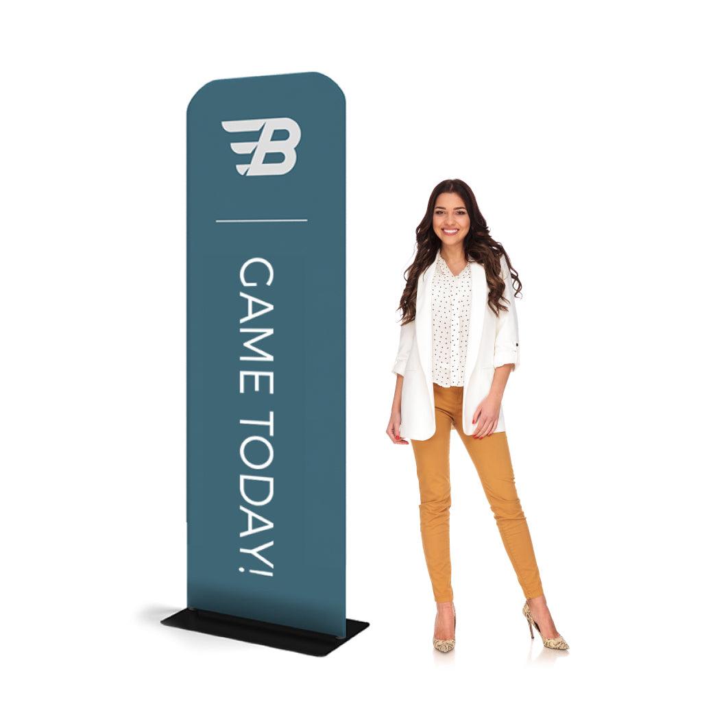Tall tabletop banner stand with branding and game promotion next to smiling woman for trade shows