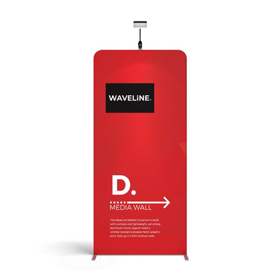 Trade show media wall display panel with branding and overhead spotlight for exhibitions