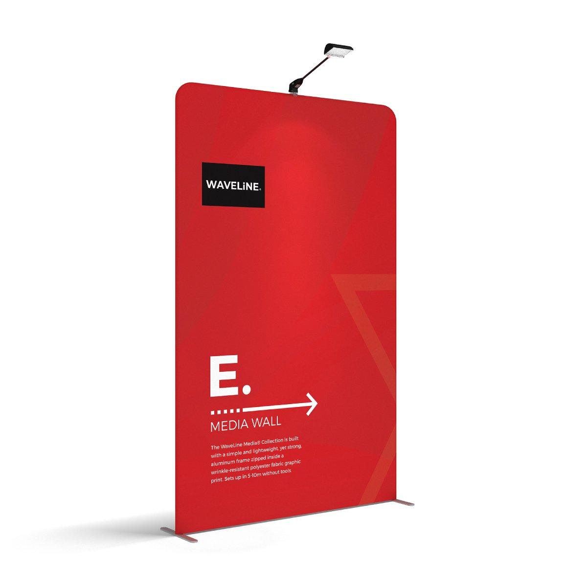 Waveline Media Wall display panel with fabric graphic and overhead light for trade shows and exhibitions