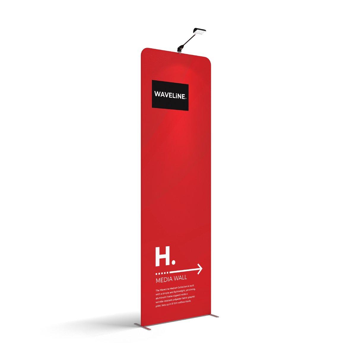 Tall waveline media wall display with graphic print and overhead light for trade shows and exhibitions