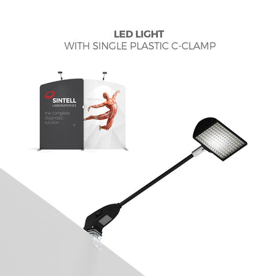 LED light with single plastic c-clamp attached to trade show display for exhibitions and special events