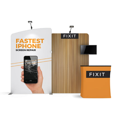 Trade show booth with curved and wood panel displays, screen, and counter for iPhone screen repair service