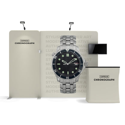 Trade show booth display with large watch image, branded counter, and mounted screen for exhibitions