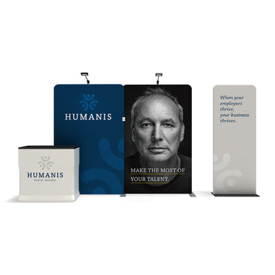 Trade show display with branded backdrops and counter featuring motivational business messages