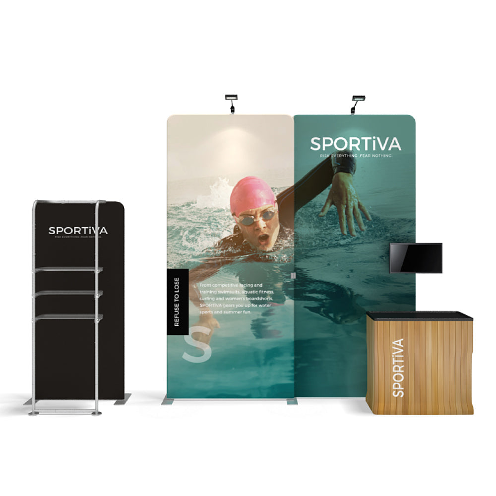 Trade show display with large graphic panels, shelving unit, and branded counter for exhibitions