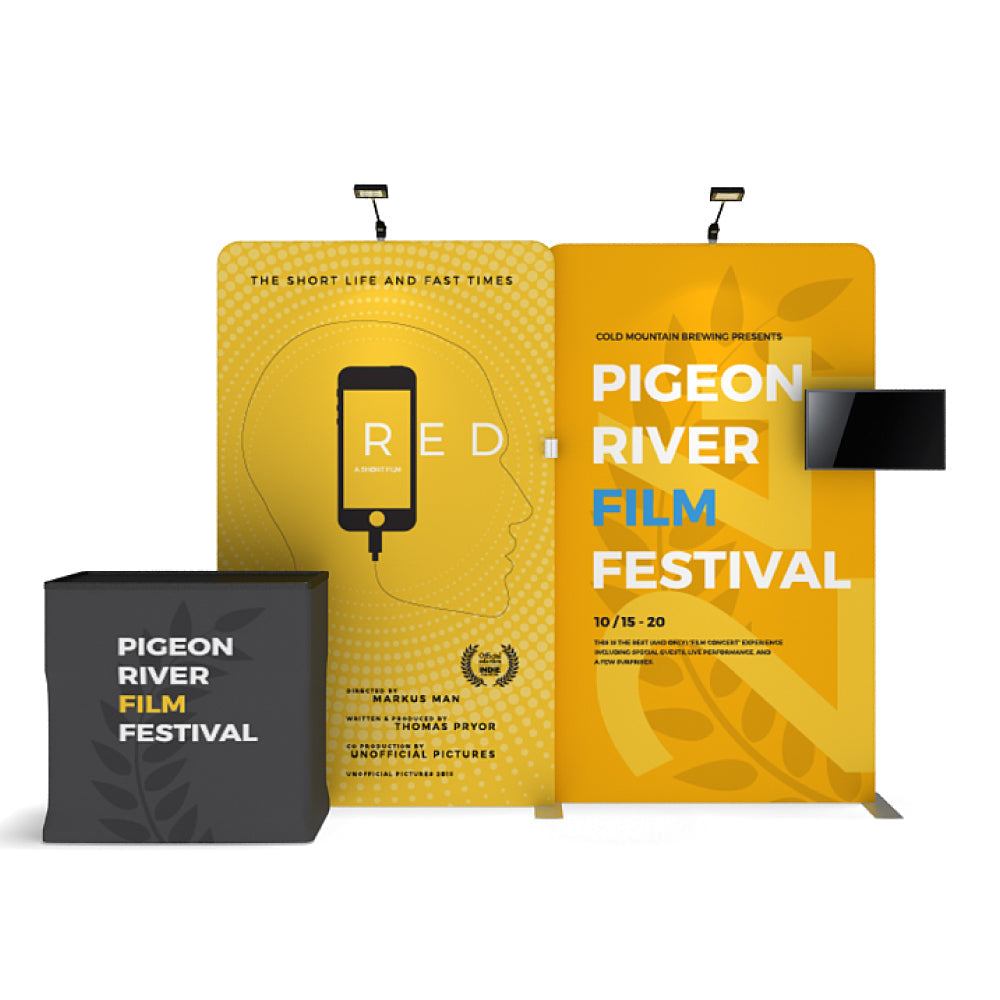 Trade show display with banner stands and a counter promoting Pigeon River Film Festival