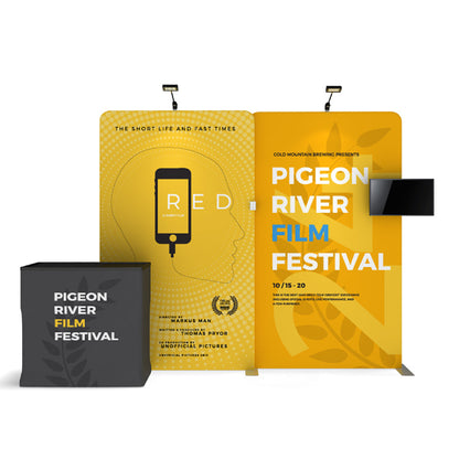 Trade show display with banner stands and a counter promoting Pigeon River Film Festival