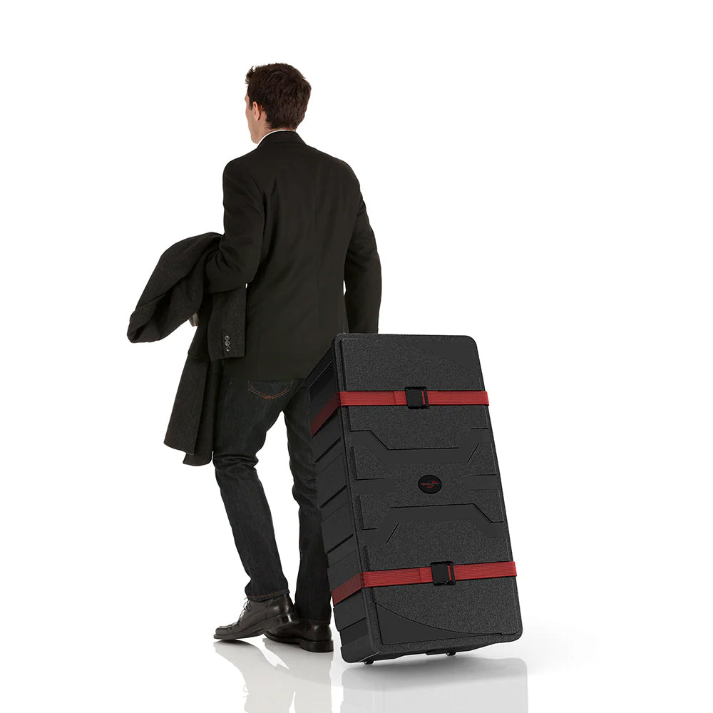 Man in business attire pulling large protective rolling case for trade shows and exhibitions