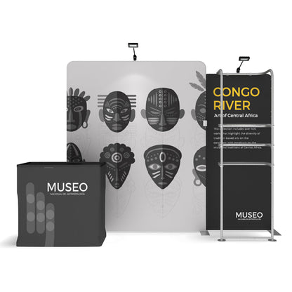 Trade show display with Museo branded counter, exhibition backdrop featuring African masks, informational banner