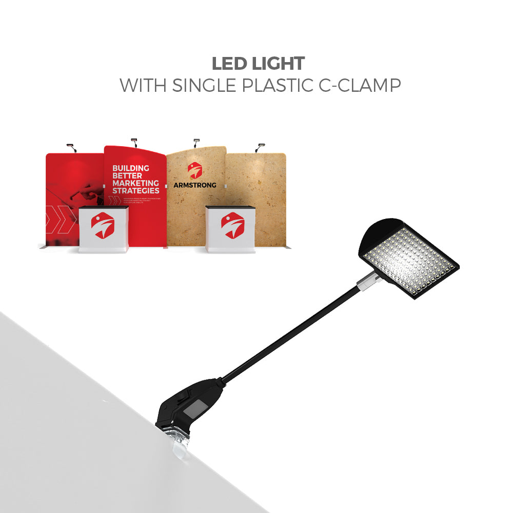 LED light with single plastic C-clamp highlighting trade show display panels and booths