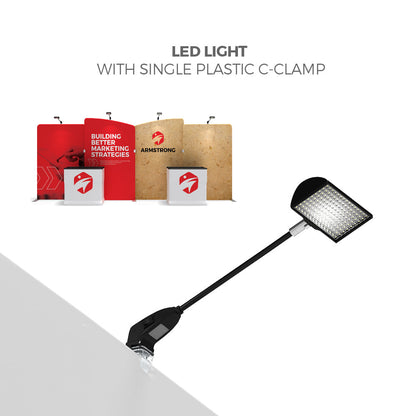 LED light with single plastic C-clamp highlighting trade show display panels and booths