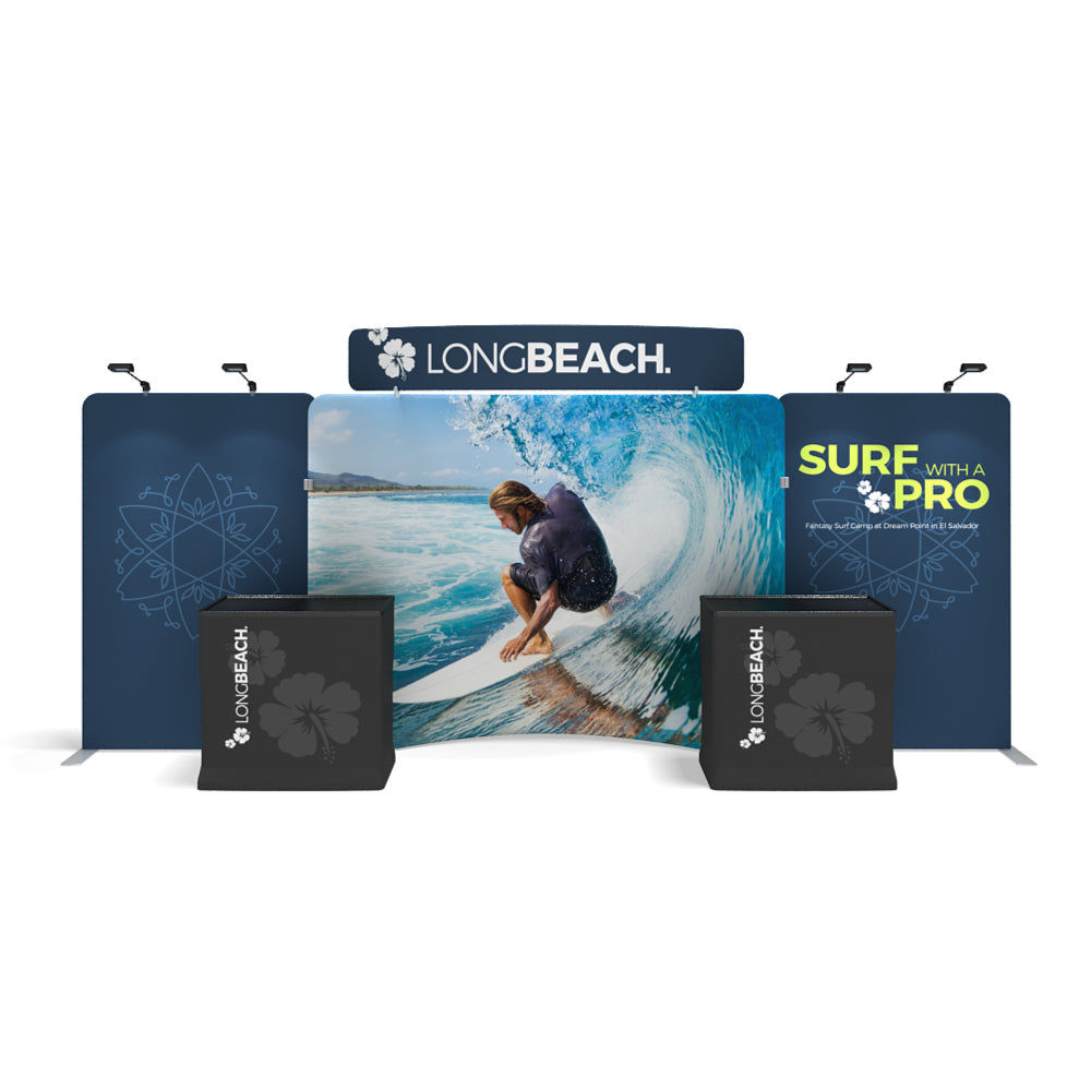 Trade show exhibition booth with branded backdrops and counters featuring surfing imagery and promotional graphics