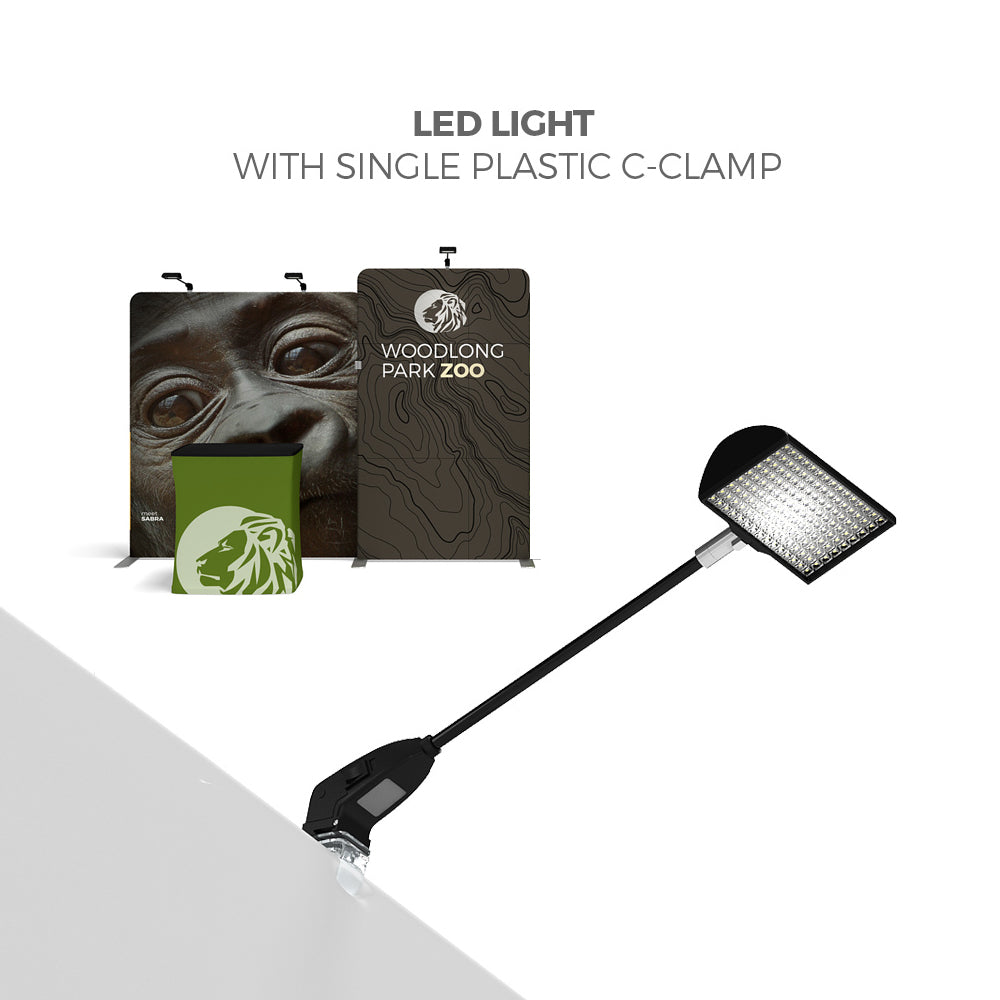 LED light with plastic C-clamp illuminating trade show display backdrops and counters at exhibitions and events