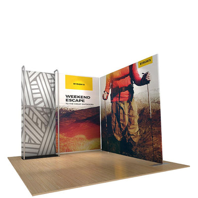 Modular trade show display with printed fabric panels showcasing adventure and outdoor branding