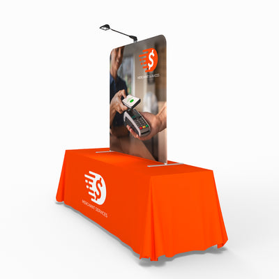 Trade show tabletop display with branded fabric cover and graphic banner for merchant services