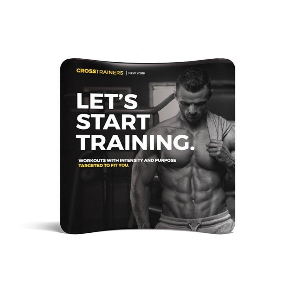 Curved trade show display featuring muscular man and motivational fitness training message for exhibitions