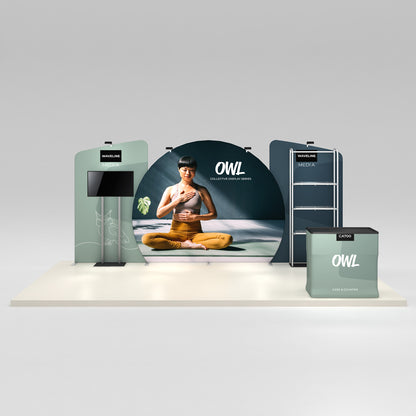 Trade show booth setup with large circular yoga-themed backdrop and media displays for exhibitions