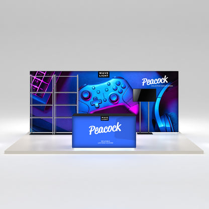 Trade show display featuring inflatable lightbox counter, large backdrop with gaming controller visuals, and monitor stand