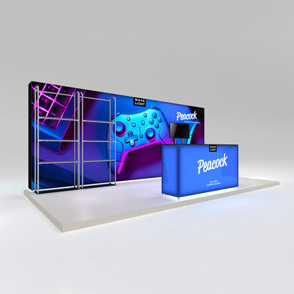 Trade show display featuring an inflatable lightbox counter and graphic backdrop with a gaming controller and keyboard image
