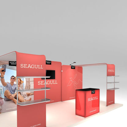 Trade show exhibit booth with branded tension fabric displays, shelving, and lightbox counter for events