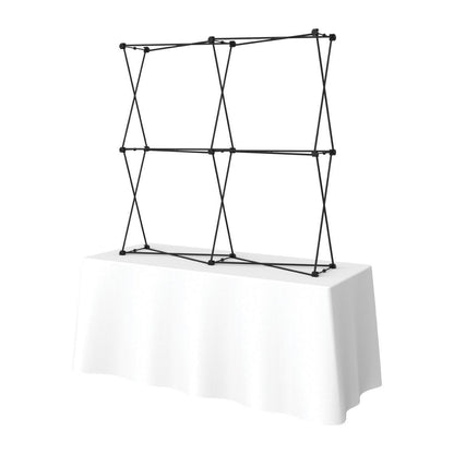 Collapsible tabletop display frame setup on a table for trade shows and exhibitions