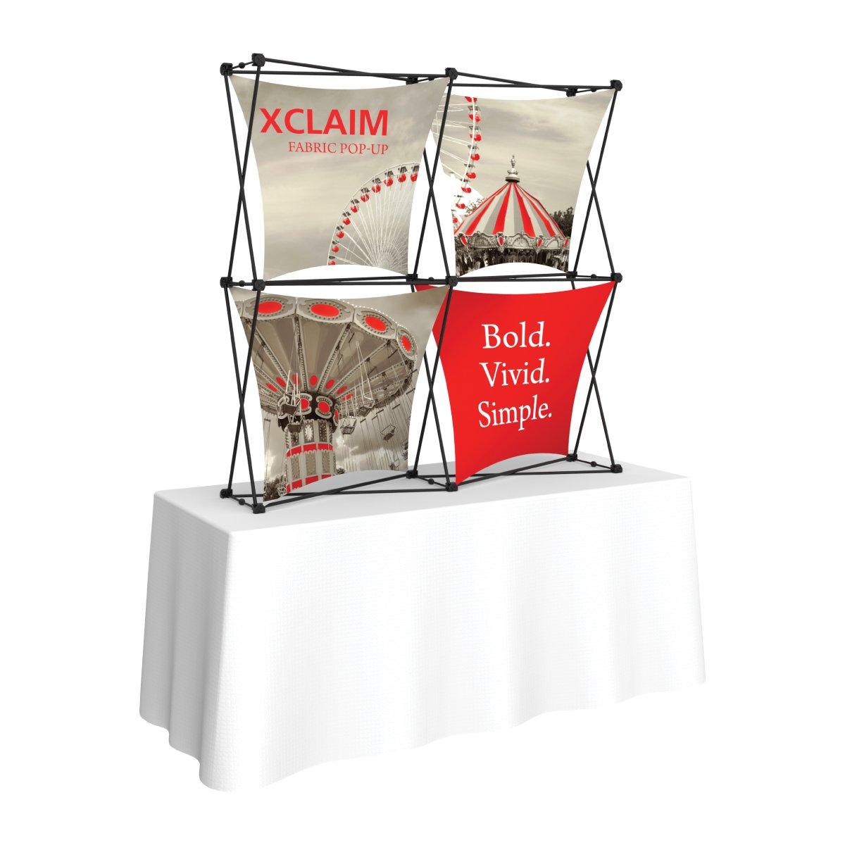 Pop-up fabric display on table for trade shows and exhibitions featuring bold, vivid graphics