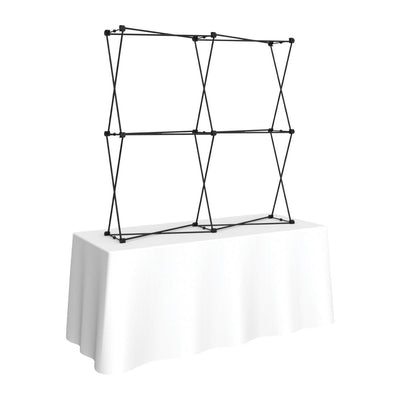 Foldable tabletop display frame set up on table for trade shows and exhibitions