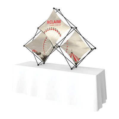 Quad pyramid fabric pop-up display with carnival image for trade shows and exhibitions on table