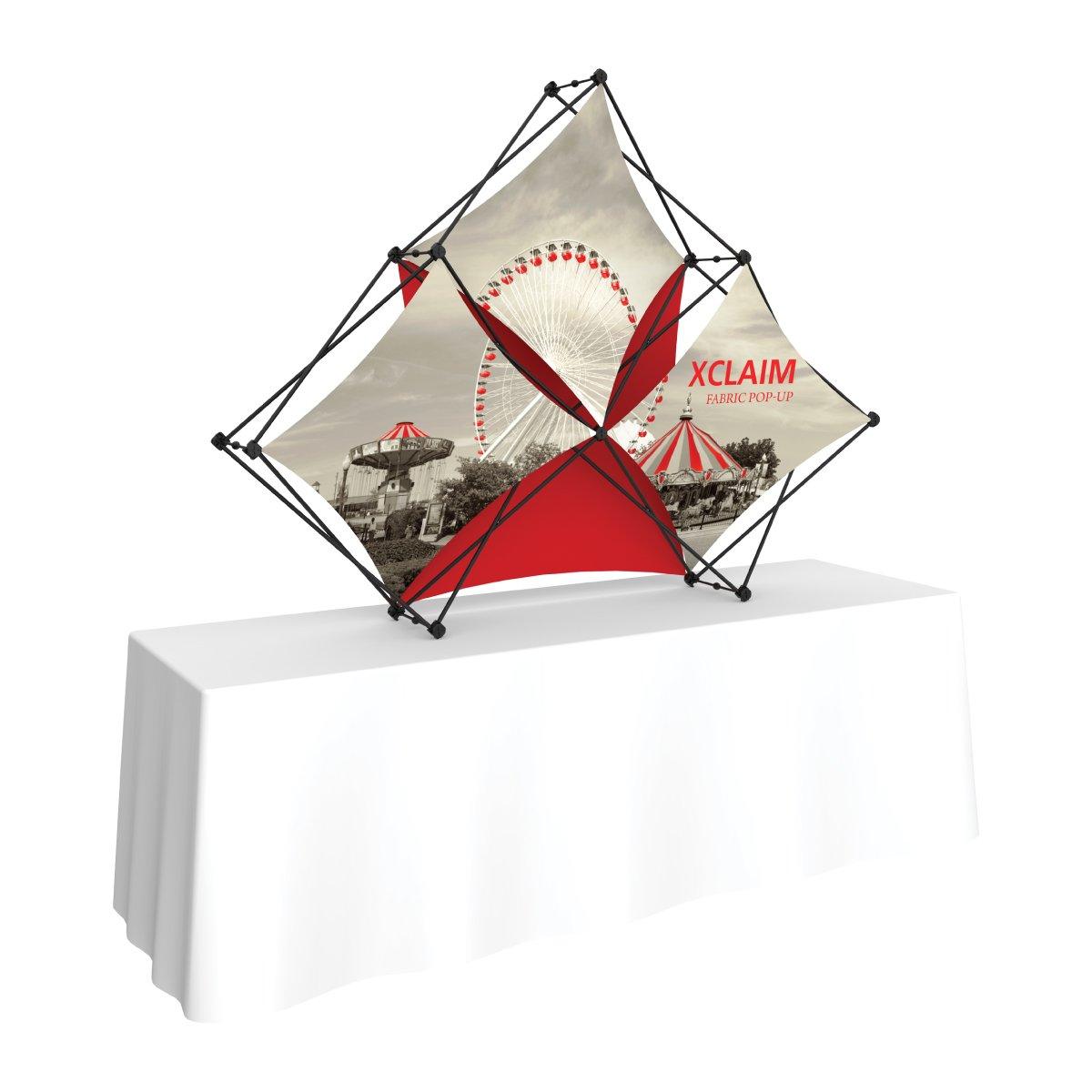 Xclaim fabric pop-up display on table, designed for trade shows and special events
