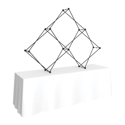 Collapsible pyramid frame on a table with a cloth, ideal for trade show or exhibition displays