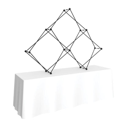 Collapsible pyramid frame on a table with a cloth, ideal for trade show or exhibition displays